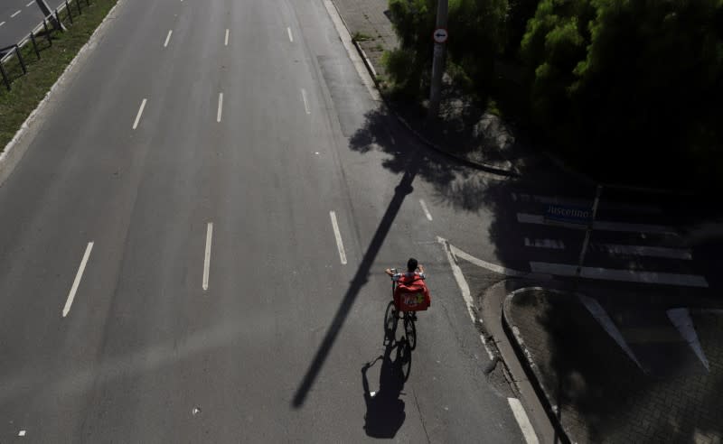 Erik Thiago, rides his bicycle, amid the coronavirus disease (COVID-19) outbreak, in Sao Paulo