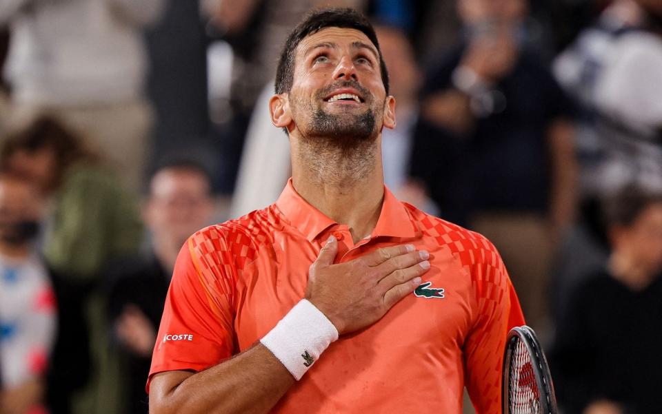 Novak Djokovic celebrates after winning against Marton Fucsovics at Roland Garros - Novak Djokovic’s Iron Man-like device that ‘turns body heat into light’ - AFP/Thomas Samson