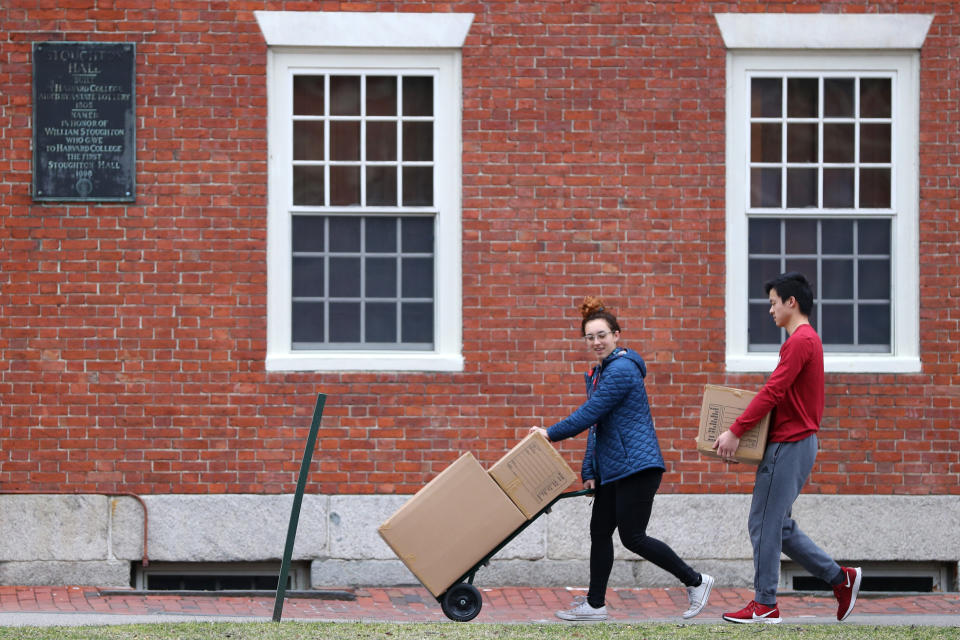 CAMBRIDGE, MASSACHUSETTS - MARCH 12: Students move out of dorm rooms on Harvard Yard on the campus of Harvard University on March 12, 2020 in Cambridge, Massachusetts. Students have been asked to move out of their dorms by March 15 due to the Coronavirus (COVID-19) risk. All classes will be moved online for the rest of the spring semester.  (Photo by Maddie Meyer/Getty Images)