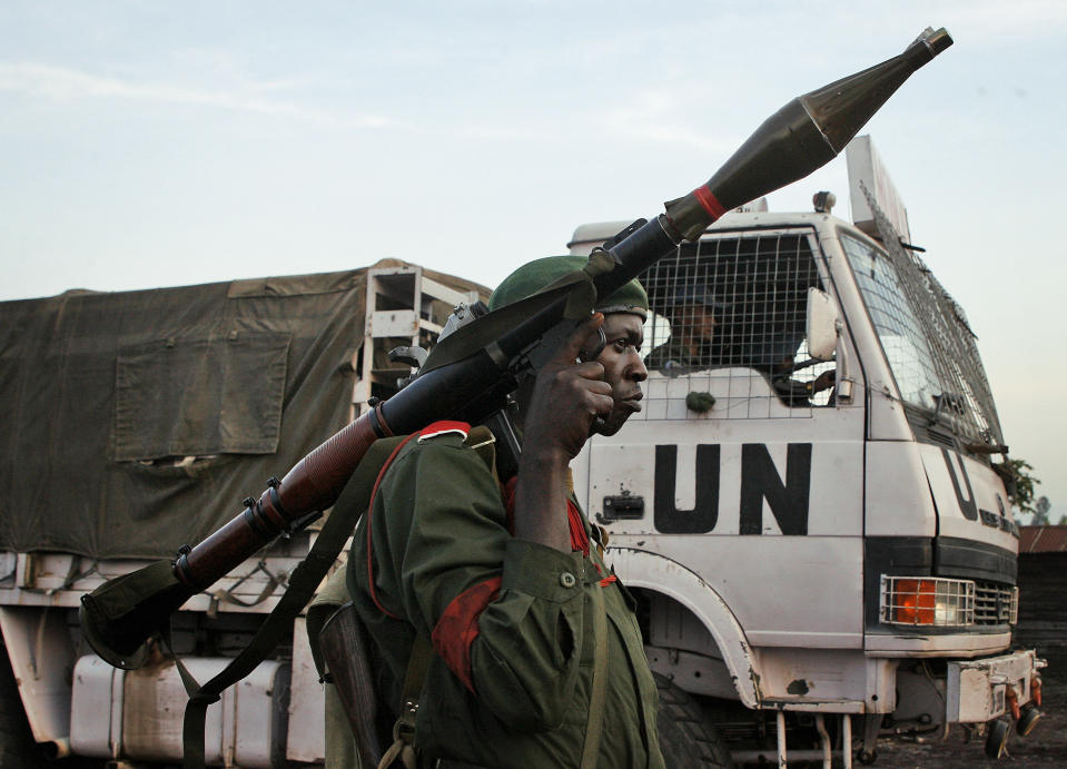 FILE - A Congolese government soldier (FARDC) stands guard by a UN truck at the Kibati checkpoint north of Goma, eastern Congo, on Nov. 23, 2008. The United Nations Peacekeeping efforts is under resourced as its $5.5 billion budget for worldwide operations is less than the New York Police Department's $6.1 billion budget, even though it has 30,000 more personnel, the UN Under-Secretary General, Peace Operations Jean-Pierre Lacroix said Wednesday, Dec. 6, 2023 at a two-day UN Peacekeeping Ministerial Meeting in Accra, Ghana. (AP Photo/Jerome Delay, File)