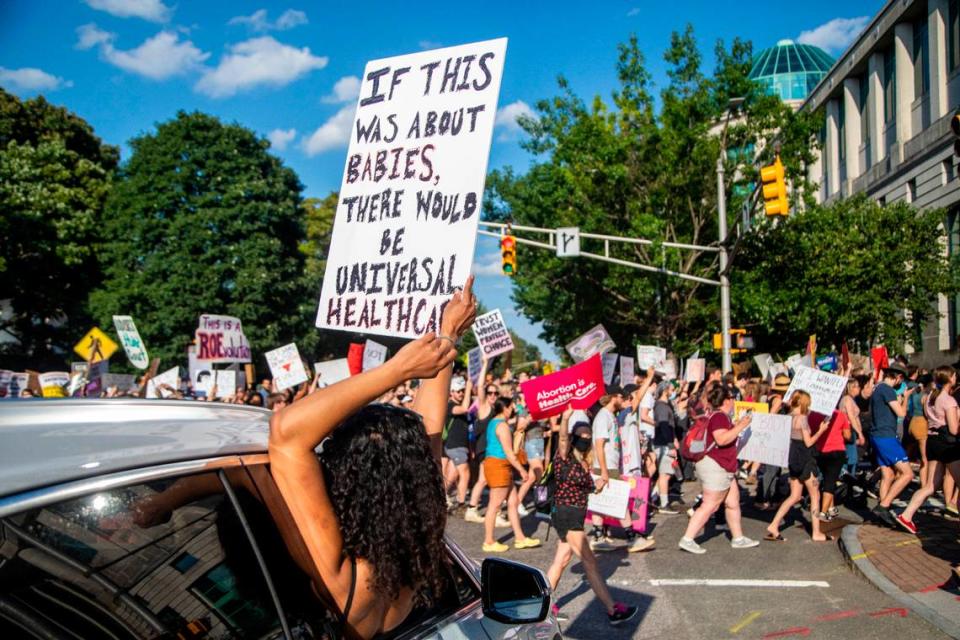 Hundreds of demonstrators rally and march in downtown Raleigh Friday, June, 24, 2022 in opposition to the U.S. Supreme Court’s decision to overturn its landmark Roe v. Wade ruling.