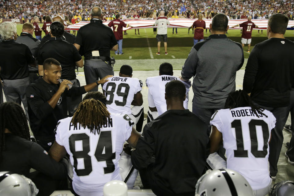 Members of the Raiders took a knee a few miles away from the White House on Sunday night. (AP) 
