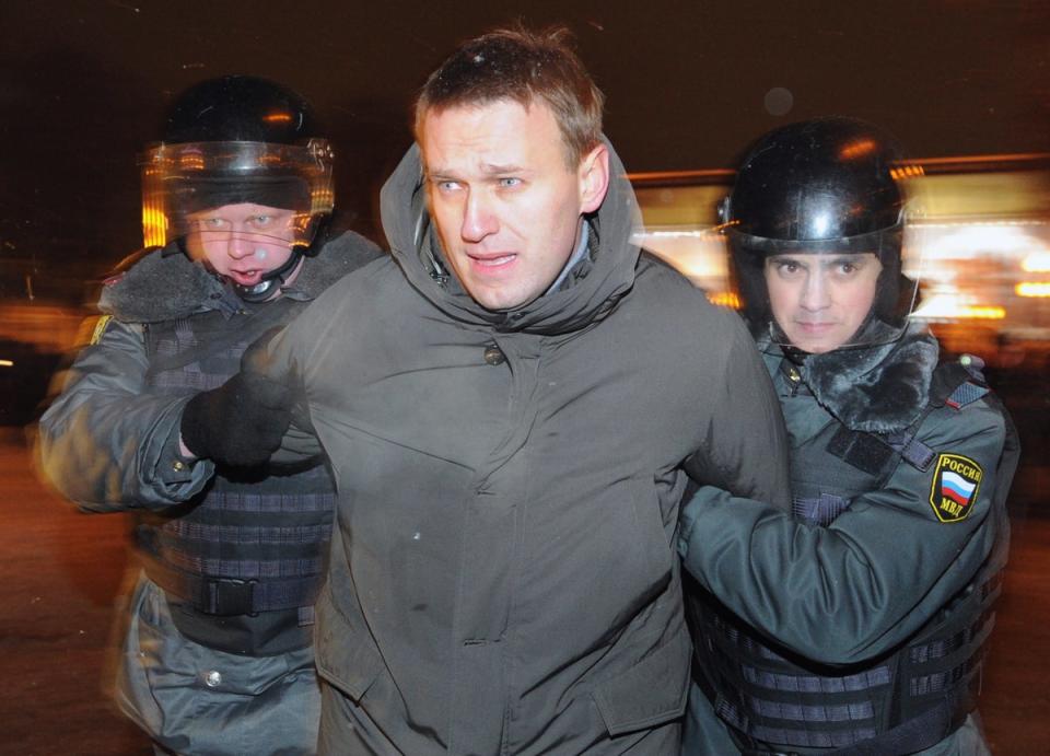 Police officers detain Alexeo Navalny, at Moscow's Pushkinskaya Square, on March 5, 2012 (AFP via Getty Images)