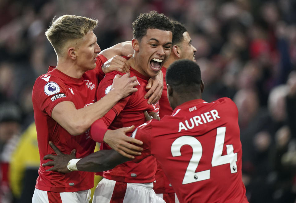 Nottingham Forest's Brennan Johnson, center, celebrates scoring the opening goal during the English Premier League soccer match between Leicester City and Nottingham Forest at the City Ground in Nottingham, England, Saturday Jan. 14, 2023. (Mike Egerton/PA via AP)