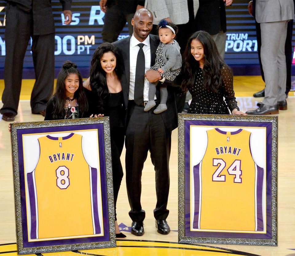 The historic player proudly poses with his family after both of his No. 8 and No. 24 Los Angeles Lakers jerseys are retired at the Staples Center in L.A. on Dec. 18, 2017. After <a href="https://people.com/parents/kobe-bryant-wife-vanessa-welcome-daughter-capri-kobe/" rel="nofollow noopener" target="_blank" data-ylk="slk:welcoming his fourth child;elm:context_link;itc:0;sec:content-canvas" class="link ">welcoming his fourth child</a> with his wife, daughter Capri, in the summer of 2019, Bryant tragically lost his life on Jan. 26, 2020, <a href="https://people.com/sports/kobe-bryant-dies-helicopter-crash-calabasas/" rel="nofollow noopener" target="_blank" data-ylk="slk:in a helicopter crash;elm:context_link;itc:0;sec:content-canvas" class="link ">in a helicopter crash</a> in Calabasas, California, PEOPLE confirmed. He was 41.