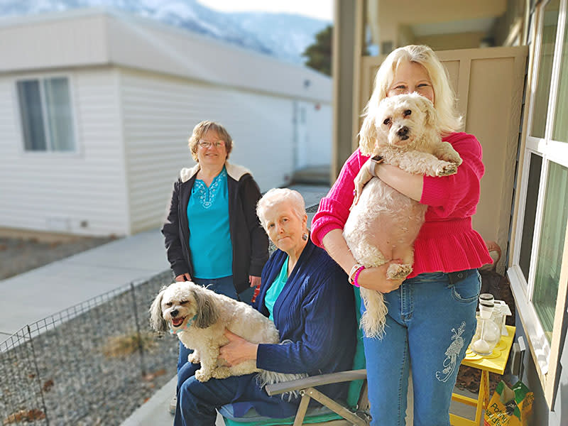 <span><span>Carole (center) holding hero Shadow, with Charmaine (right) holding Maybelline and Susan (left)</span></span>