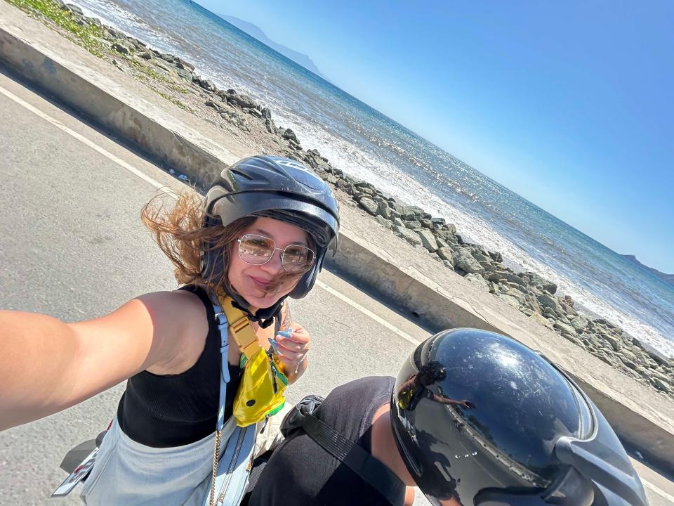 Woman riding on a scooter in Timor-Leste.