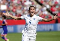 England midfielder Fara Williams (4) celebrates after scoring a goal on a penalty kick during the first half against Japan in the semifinals of the FIFA 2015 Women's World Cup at Commonwealth Stadium. Erich Schlegel-USA TODAY Sports