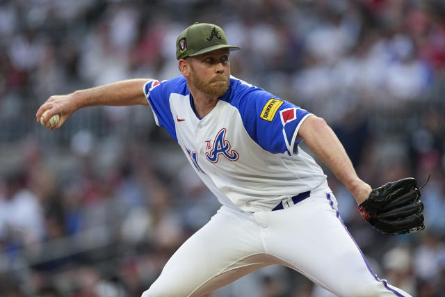 Atlanta Braves relief pitcher Michael Tonkin works in the third inning of a baseball game against the Seattle Mariners, Saturday, May 20, 2023, in Atlanta. (AP Photo/John Bazemore)