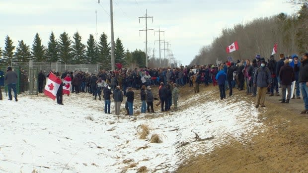 The demonstrators carried a variety of messaging, much of it in opposition to public health restrictions. (CBC - image credit)