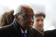 CAPTION CORRECTS SPELLING OF SURNAME Former president of the IAAF (International Association of Athletics Federations) Lamine Diack arrives at the Paris courthouse, Monday, Jan. 13, 2020. One of the biggest sports corruption cases to reach court is being heard in Paris from Monday, with explosive allegations of a massive doping cover-up at the top of track and field. (AP Photo/Thibault Camus)