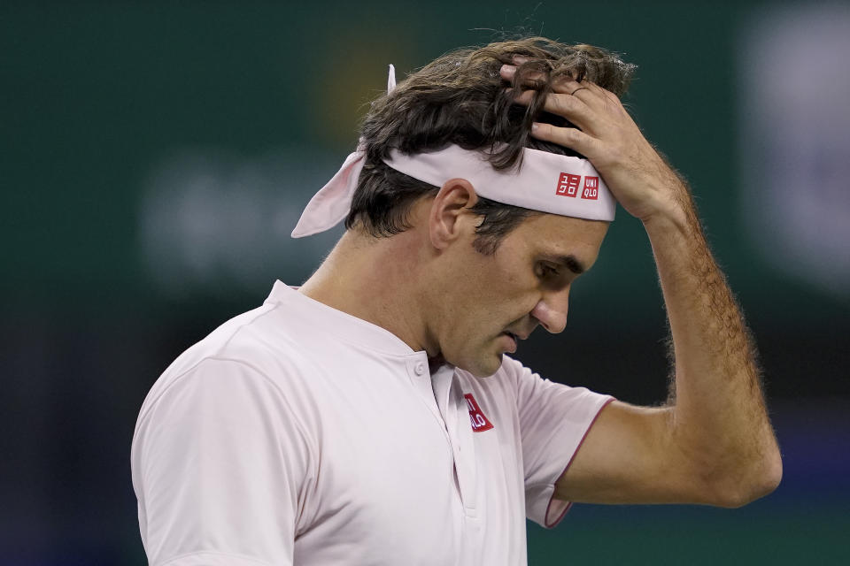 Roger Federer of Switzerland reacts after losing a point to Borna Coric of Croatia during their men's singles semifinals match in the Shanghai Masters tennis tournament at Qizhong Forest Sports City Tennis Center in Shanghai, China, Saturday, Oct. 13, 2018. (AP Photo/Andy Wong)