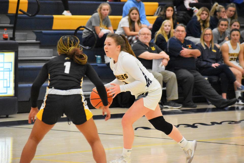 Mooresville's Emma McGinley passes the bal during the Pioneers' matchup with Avon on Dec. 6, 2022.