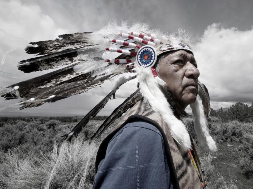 Rupert Steele of the Goshute tribe poses in a headdress.