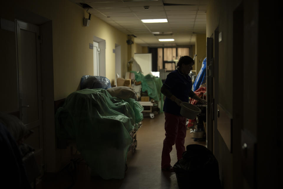 Equipment salvaged from sections damaged by Russian attacks piles on the corridor at the hospital in Izium, Ukraine, Sunday, Feb. 18, 2023. Russian attacks have devastated Ukraine's health care system, raining down explosions upon hospitals and ambulances at a rate of nearly two a day for the past year, according to a study that attempted to document each strike.(AP Photo/Vadim Ghirda)