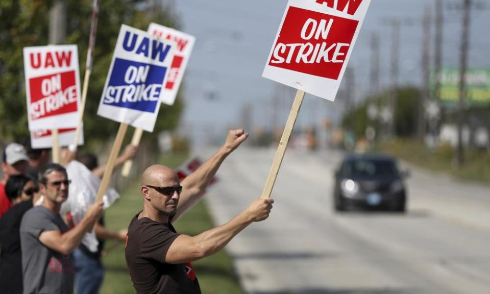 UAW workers strike outside the GM facility in Parma, Ohio. ‘The corporation is making a lot of money and they need to invest some of it back into us.’