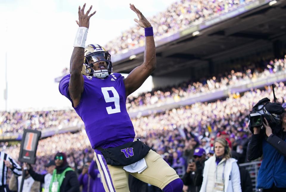 Washington quarterback Michael Penix Jr. reacts after scoring a touchdown against Utah during the first half of an NCAA college football game Saturday, Nov. 11, 2023, in Seattle. | Lindsey Wasson, Associated Press