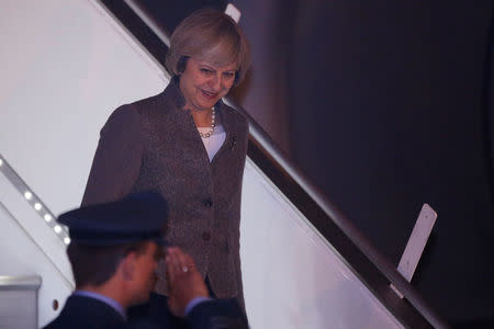 Britain's Prime Minister Theresa May disembarks from an aircraft upon her arrival at the airport in New Delhi, India, November 6, 2016. REUTERS/Adnan Abidi