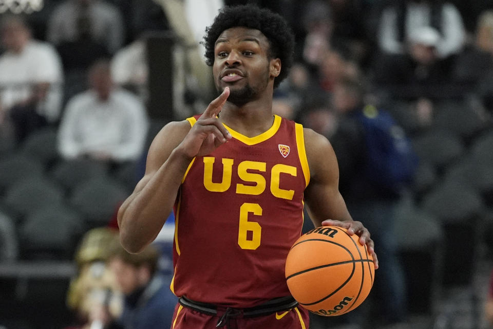 FILE - Southern California's Bronny James (6) drives up the court against Washington during the first half of an NCAA college basketball game in the first round of the Pac-12 tournament Wednesday, March 13, 2024, in Las Vegas. NBA teams were told Monday, May 13, 2024, that Bronny James, the son of the Los Angeles Lakers' LeBron James, has been medically cleared to play in the league and is expected to participate in the draft combine this week, a person with knowledge of the matter told The Associated Press. (AP Photo/John Locher, File)