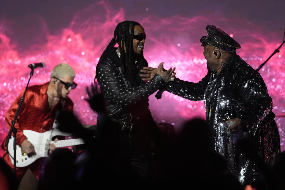 Andrew Watt, left, Quavo, middle and George Clinton perform onstage at the 2024 Recording Academy Honors presented by The Black Music Collective in Los Angeles Thursday, Feb. 1, 2024. (AP Photo/Damian Dovarganes)