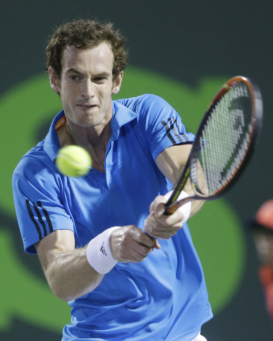 Andy Murray of Great Britain, returns a shot from Matthew Ebden of Australia, at the Sony Open tennis tournament, Friday, March 21, 2014, in Key Biscayne, Fla. (AP Photo/Wilfredo Lee)