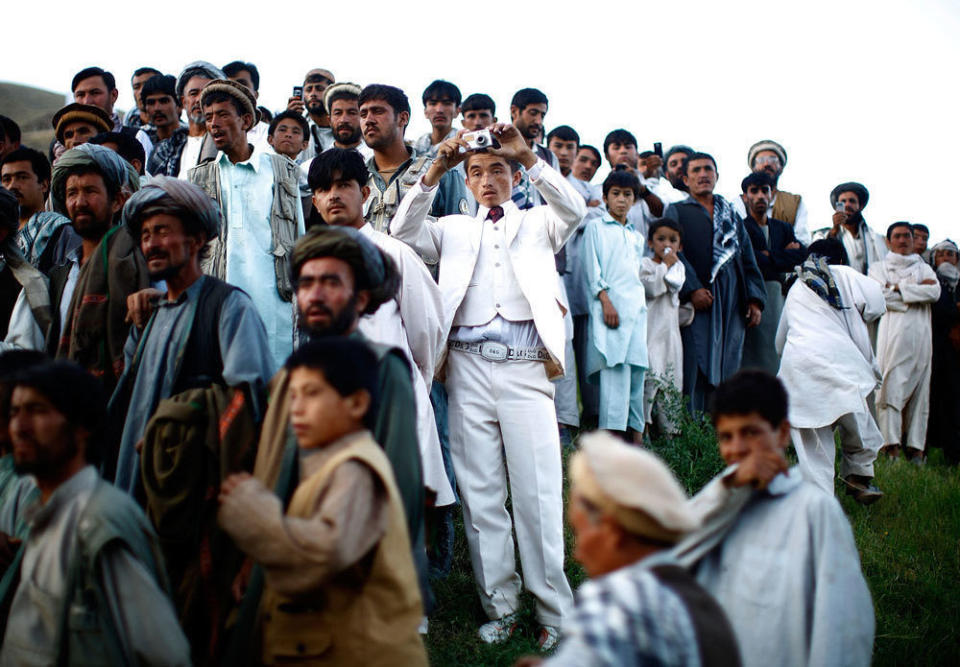 Afghan President Hamid Karzai held a rally in a remote village, where he struck a deal with an influential religious leader. Thousands gathered for the campaign event. <i>From the story "<a href="http://www.npr.org/templates/story/story.php?storyId=111605691" target="_blank">Afghan President Karzai Rallies Support</a>," 2009.</i>