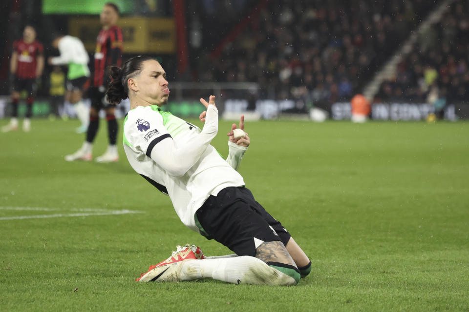 Liverpool's Darwin Nunez celebrates after scoring his side's opening goal during the English Premier League soccer match between AFC Bournemouth and Liverpool at the Vitality Stadium, in Bournemouth, England, Sunday, Jan. 21, 2024. (AP Photo/Ian Walton)