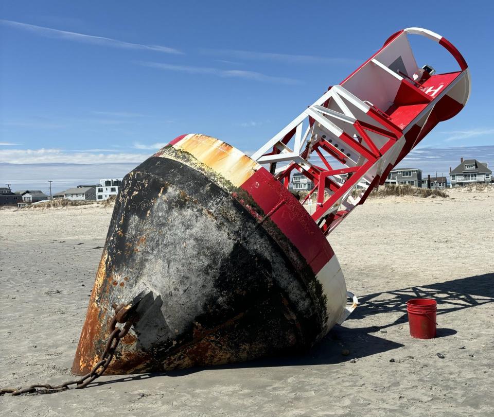 This buoy, which drifted onto Wells Beach in Maine after a recent storm, is scheduled to be towed back out to sea by the U.S. Coast Guard on Monday, April 22, 2024.