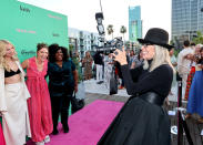 <p>Diane Keaton joyfully joins the photographers on Aug. 10 at the <em>Mack and Rita </em>premiere in L.A. </p>