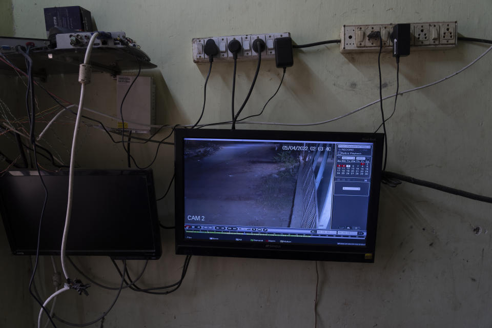 A screen with footage from a CCTV camera is seen at a local dairy farm in Aarey Colony, which borders the south end of Sanjay Gandhi National Park, in Mumbai, India, Tuesday, April 5, 2022. Los Angeles and Mumbai, India are the world’s only megacities of 10 million-plus where large felines breed, hunt and maintain territory within urban boundaries. Long-term studies in both cities have examined how the big cats prowl through their urban jungles, and how people can best live alongside them. (AP Photo/Rafiq Maqbool)