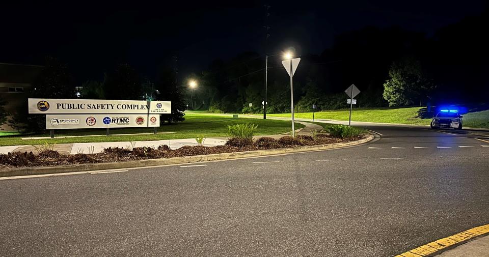 A Tallahassee Police Department officer blocks the entrance to Tom Brown Park at the roundabout near Easterwood Drive and Weems Road around 2:30 a.m. Friday, May 26, 2023. According to TPD, a woman opened fire and "ambushed" officers in the park Thursday night. Officers returned fire, striking and killing the woman.