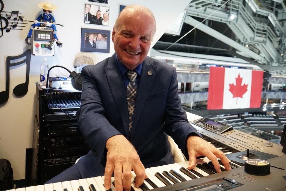 Scotiabank Arena organist Jimmy Holmstrom tries to pump up the crowd through tunes that make them clap or stomp.
