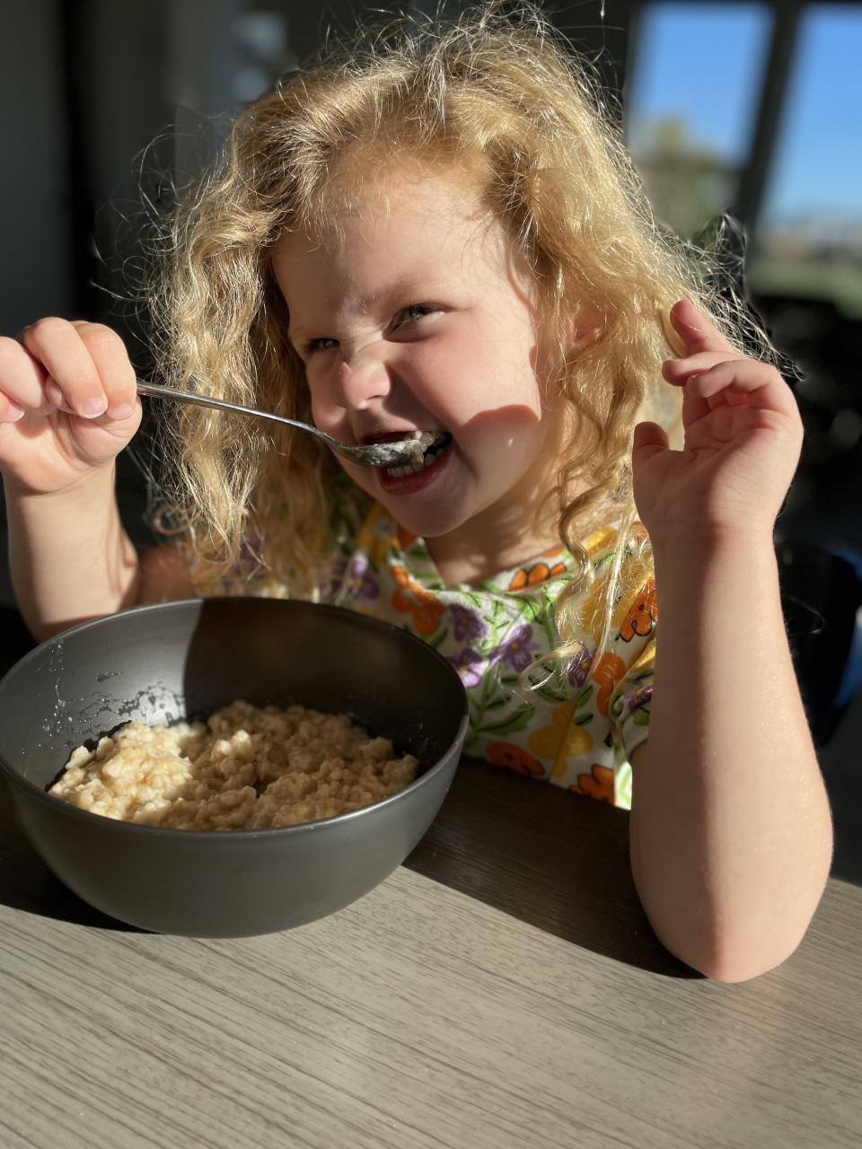 author's daughter eating oatmeal