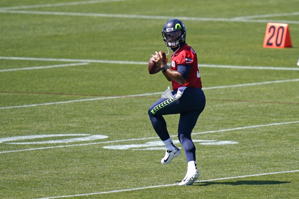 Russell Wilson drops back to pass during training camp.