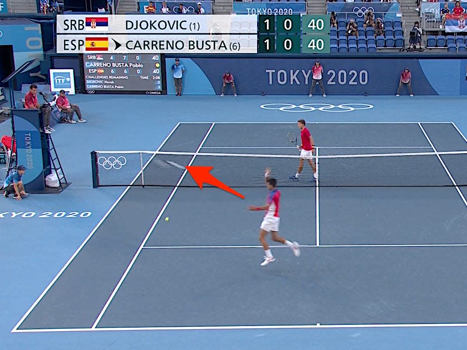 Novak Djokovic throws his racket during the Tokyo Olympics.