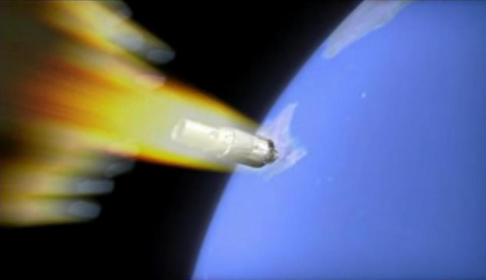 An artist's illustration of China's Tiangong-1 space station falling to Earth as it burns up in the atmosphere. The spacecraft is expected to crash uncontrolled sometime overnight on April 1 or 2, 2018. <cite>China Manned Space Engineering Office</cite>