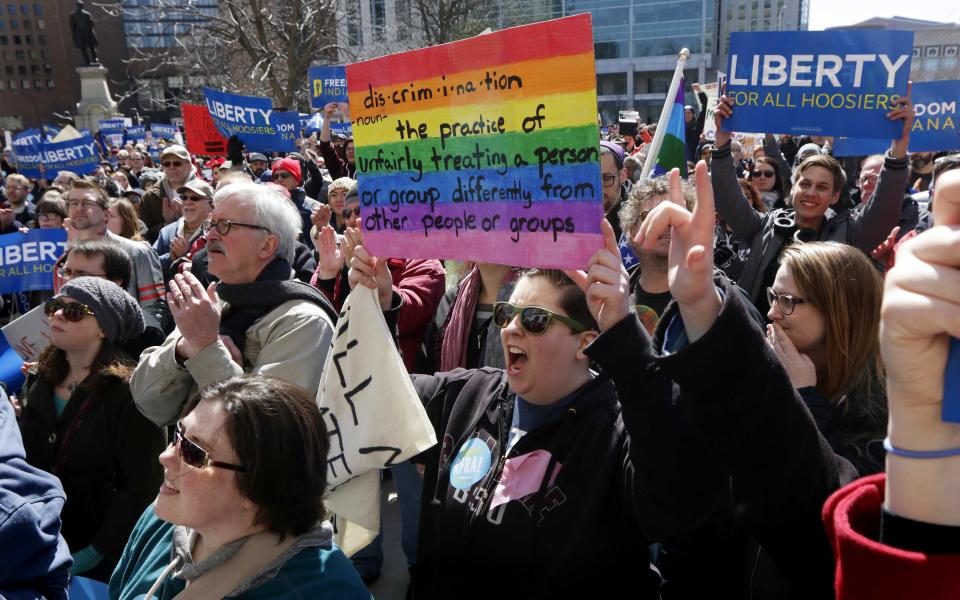 Demonstrators gather to protest a controversial religious freedom bill in Indianapolis