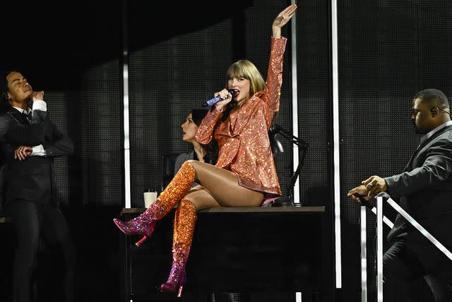 <p>JULIEN DE ROSA/AFP via Getty</p> Taylor Swift performs at the Eras Tour at the Paris La Defense Arena on May 9, 2024