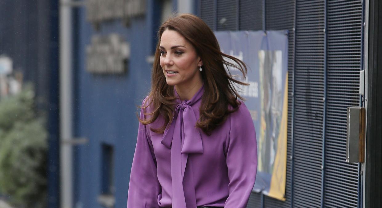 Kate Middleton wore the same purple Gucci blouse to visit the Henry Fawcett Children's Centre in March 2019. (Getty Images)