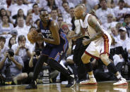 Charlotte Bobcats' Al Jefferson (25) looks to pass as Miami Heat's Chris Andersen (11) defends during the first half in Game 1 of an opening-round NBA basketball playoff series on Sunday, April 20, 2014, in Miami. (AP Photo/Lynne Sladky)