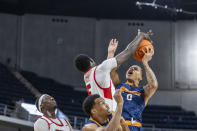 UTEP guard Zid Powell (0) works inside with Western Kentucky forward Babacar Faye (5) defending during the first half of an NCAA college basketball game at the Conference USA Tournament final, Saturday, March 16, 2024, in Huntsville, Ala. (AP Photo/Vasha Hunt)