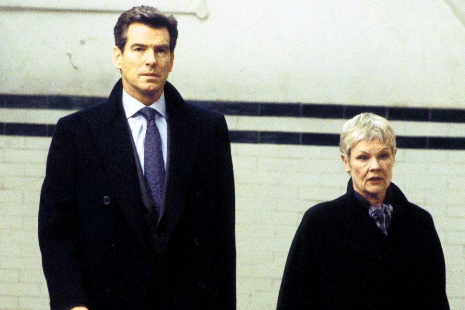 <p>Moviestore/Shutterstock</p> Pierce Brosnan and Judi Dench in 