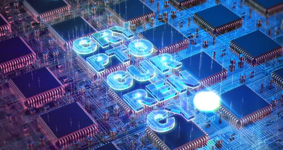 The word cryptocurrency spelled out on semiconductor chips and circuitry.