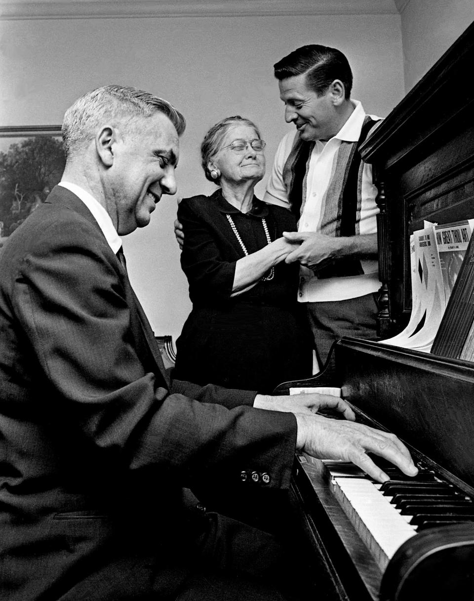 Jim Roberts, right, featured vocalist with the Lawrence Welk Orchestra, sings "Danny Boy" to his half-sister, Mrs. Stella Farley of Primrose Ave. in Nashville. Roberts, who arrived in town with the orchestra April 2, 1963, visits his half-sister, whom he had not seen for 20 years.