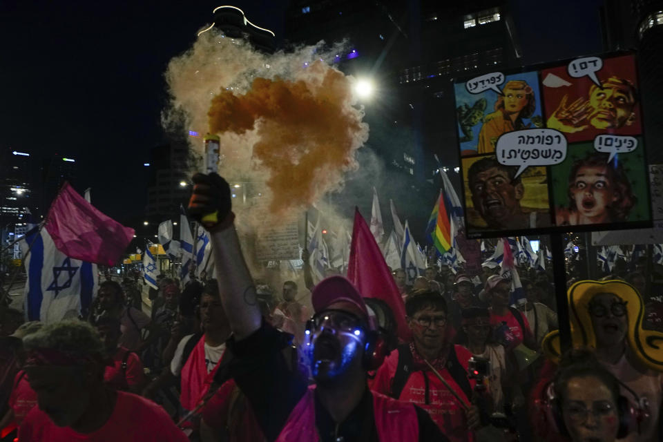 Israelis protest against plans by Prime Minister Benjamin Netanyahu's government to overhaul the judicial system, in Tel Aviv, Israel, Saturday, April 8, 2023. (AP Photo/Ariel Schalit)