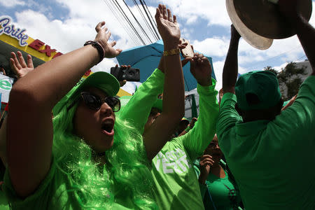 People participate in a protest against corruption after a Dominican judge approved terms of a $184 million fine on Odebrecht which sought a plea deal after admitting to bribing officials to win contracts in the country, in San Francisco de Macoris, Dominican Republic April 23, 2017. REUTERS/Ricardo Rojas