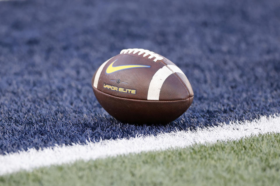 A Nike Air Vapor football is seen on the field before an NCAA football game on Saturday, Sept. 16, 2023, in Morgantown, W. Va. (AP Photo/Gregory Payan)