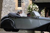 <p>The bride was chauffeured to her wedding ceremony in a Rolls Royce. Her father, Michael Middleton, accompanied her in the backseat. (Photo: AP) </p>