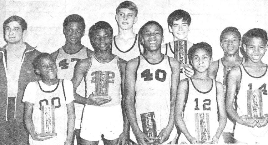 A group of very happy Bartlesville Boys Club players, including Rickey Jackson, standing second from left, celebrate their 1968 Gunners Junior High Division championship. The team finished 6-0. In the front row, from left, are Ronnie Edwards, Jackson, Lyle Taylor, Karl Goree and Ronnie Chambers; in the back row, from left, are coach Tuffy Mayor, Bob Pritchard, Mike Dixon and Lovell Webb.