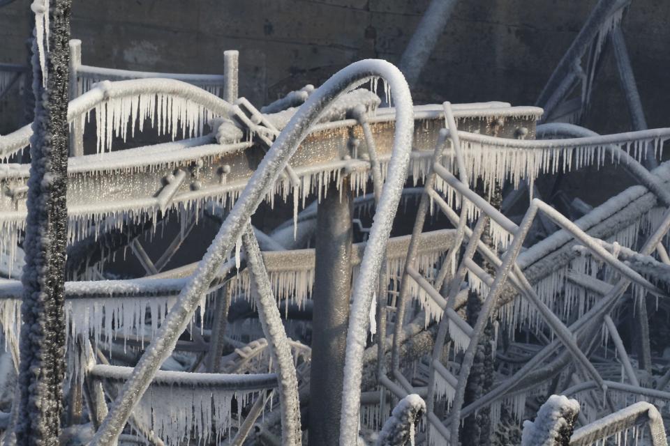 Equipment is covered with ice from water used to extinguished a fire that destroyed a chemical plant off of Route 21 in Passaic, NJ on January 15. 2022. The structure is on Passaic St.